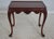 Details: Fine carved details Figural grain top with reddish mahogany high gloss finish Carved trifid feet Table is un-...