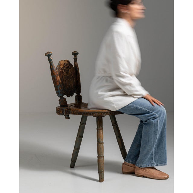 Carved oak swivel chair in Weathered Honey Oak. Finished in weathered honey oak, this carved oak swivel chair is...