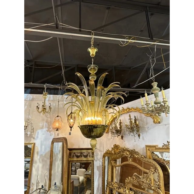 Fabulous modern apple green colored Murano glass leaf chandelier. Featuring cascading leaf forms in glistening glass. An...