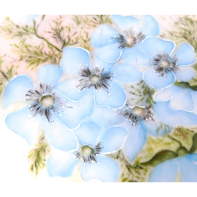 This is a Deliniers and Cie Limoges blue floral vanity tray. The tray is white with blue flowers, blue rim and two small...