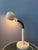 Mid-century space age cobra table lamp featuring a sculptural gooseneck design. The adjustable gooseneck arm allows the...