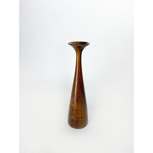 Teak candlestick, Scandinavian design, 1960s, with a clean and timeless style. This candlestick is distinguished by its...