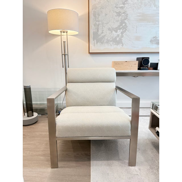 Bernhardt Marco Chair, model B4022, with a brushed stainless steel frame and neutral upholstered seat and back. Clean...