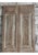 A rare pair of antique French double doors featuring exquisite hand-carved detailing and a rich, timeworn patina. Crafted...