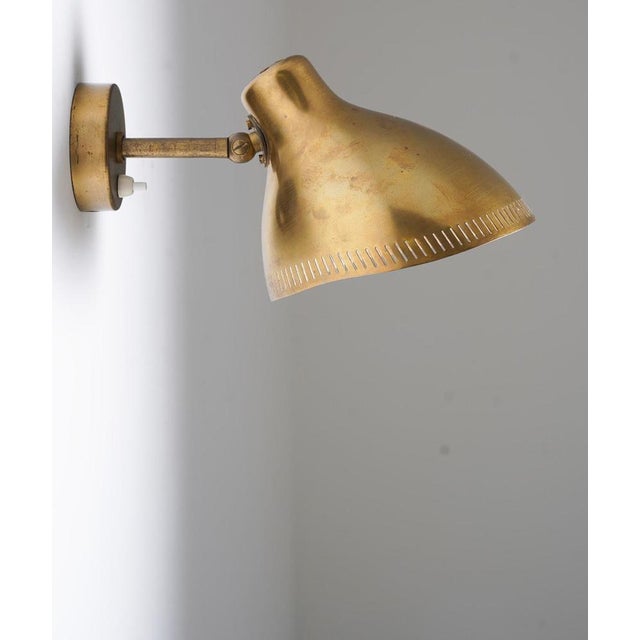 This wall lamp, designed by hans bergström for asea circa 1950, epitomizes the swedish modern style. Crafted in polished...