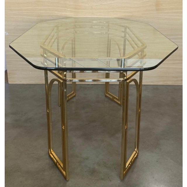Modernist Geometric vintage Dining Table from golden metal ( brass ) and clear glass 1970s Italy. A fabulous table in the...