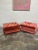 This a great orangy red velvet ottomans on casters. Great pop of color. They would great under a console with books piled...