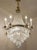 Vintage italian chandelier from the 1950s in the empire style, crafted from brass, crystal, and cut glass. the basket-...