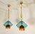 Pair of Murano glass Mid-Century Modern pendant lights, Italy circa 2000s. The Italian chandeliers are made of gold,...