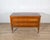 A refined neoclassical chest of drawers in walnut and cherry, distinguished by its rich inlay work and balanced...