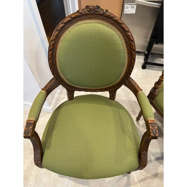 Two of the chairs have round upholstered backs and one has a square back. The same upholstery was used on all chairs. All...