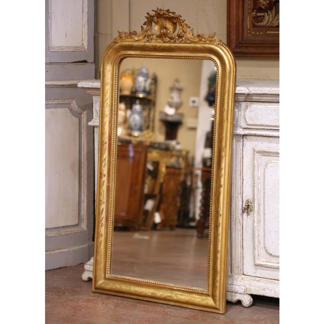Add refinement to an entryway, fireplace, or dressing area with this elegant antique mirror. Crafted in France circa 1870,...