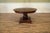 Expandable round-to-round mahogany pedestal table with self-storing leaves. This traditional design is well-suited for...