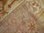 An early 20th century angora wool Oushak rug with a ivory colored field with other subtle warm accents. This is a genuine...