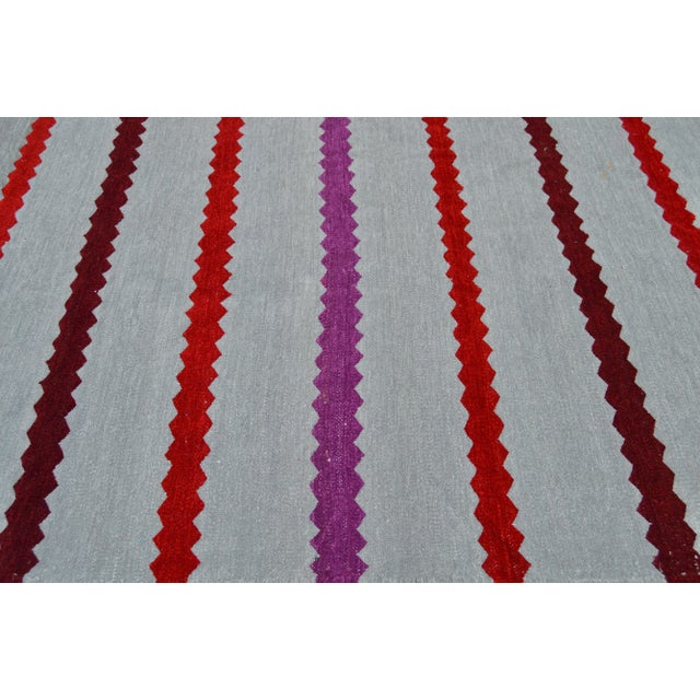 One-of-a-kind handwoven Moroccan flat-weave wool and silk rug, featuring an elegant rhythmic pattern of colorful stripes...
