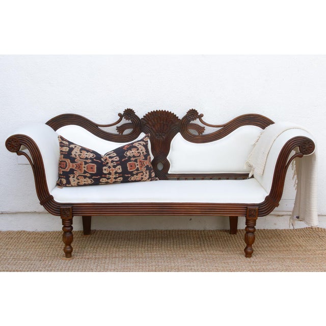 This stunning antique settee is a breathtaking example of 19th-century Anglo-Indian design, blending classical European...