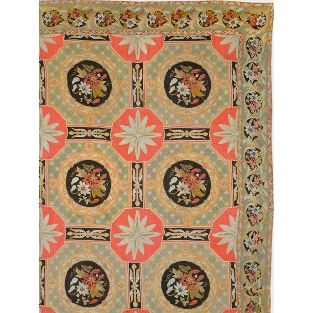 An antique English Needlepoint large carpet handmade during the 21st century. Measures: 13' 1" x 18' 8"