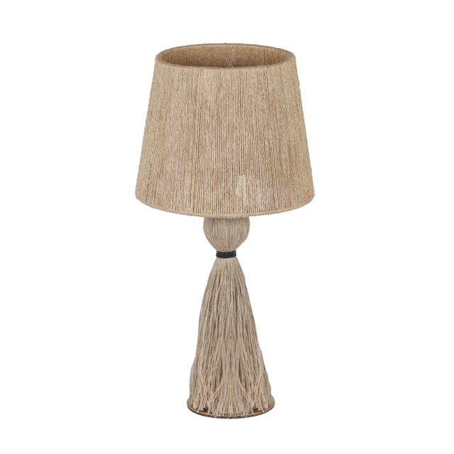 The Samba Table Lamp brings boho charm to your tabletop with a playful, sculptural presence. Locally harvested, hand-spun...