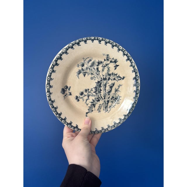 Elegant set of six antique dessert plates by Gien, Chardon pattern. A refined floral design in deep blue-gray hues on a...