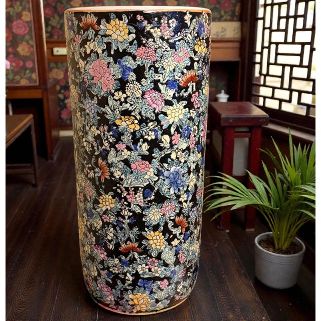 A tall Chinese export porcelain umbrella and walking stick stand, finely decorated in a dense, famille noire-influenced...