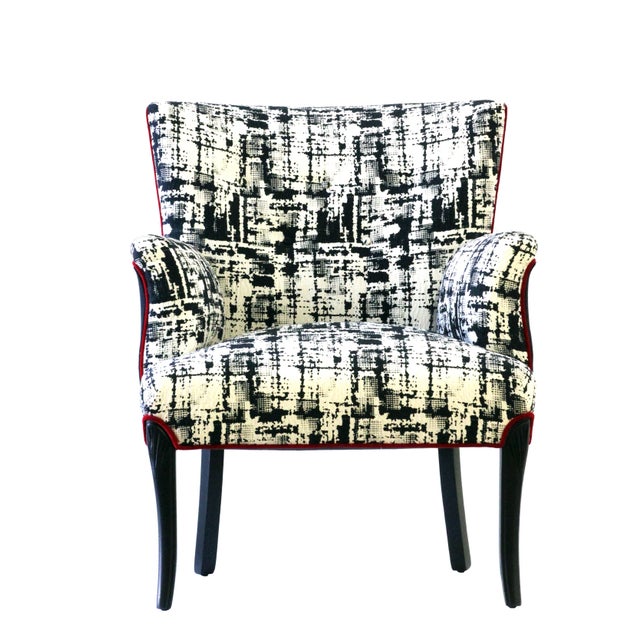 The "Metro" armchair has been completely stripped down to the bare bones and reupholstered using old-world techniques and...