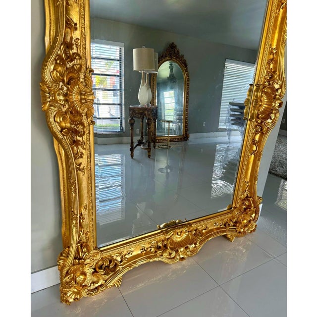 This French style Baroque wall mirror is an impressive statement piece designed to bring glamour, scale, and elegance to...