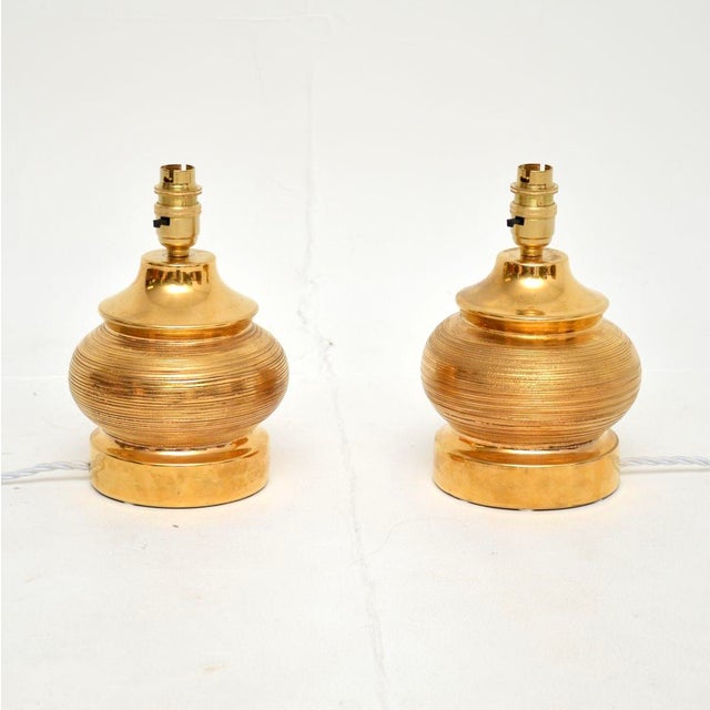 A stunning pair of vintage Italian ceramic table lamps by Bitossi. They were designed by Aldo Londi, they were made in...