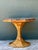 This vintage sculptural table brings together an octagonal stone top and a flared pencil reed base, a pairing rooted in...