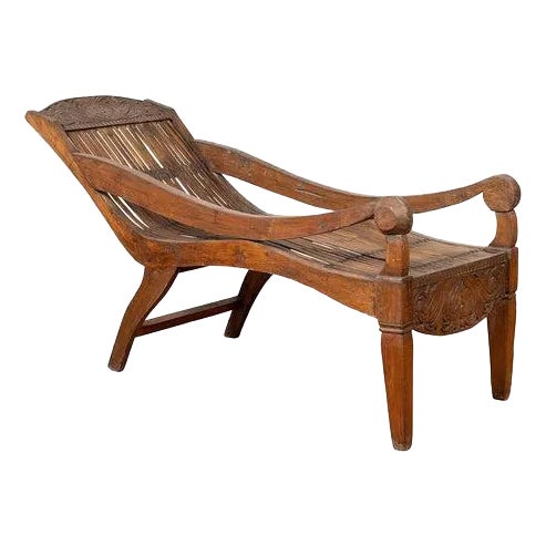 Antique Indonesian Reclining Plantation Chair with Bamboo Slats and Carved Decor For Sale