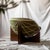Material: Solid Canaletto Walnut, Iron, and Fabric. Origin: Made in Italy, specifically in Puglia by local artisans....