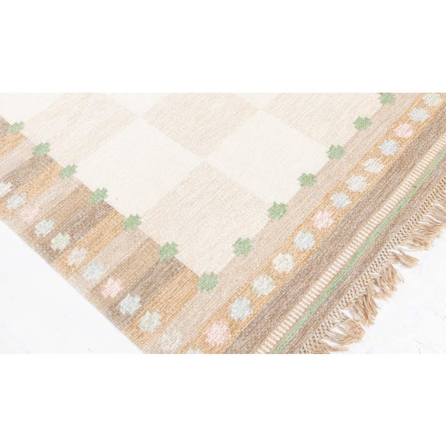 Vintage Swedish Flat Woven by Agda Osterberg Size: 4'6" × 6'10" (137 × 208 cm) This vintage Swedish flat-weave rug by...
