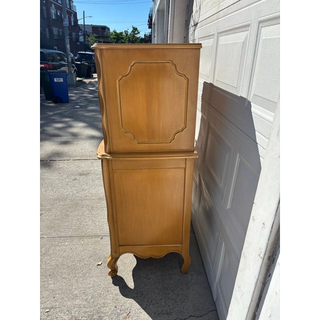 We have a beautiful vintage French Provincial lingerie chest for sale! This charming tallboy dresser features curved...