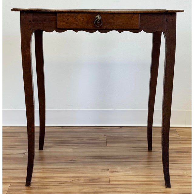 Antique hand-carved walnut side table with scalloped apron, curved legs and a beautiful patina. Single dovetailed drawer...
