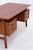 Stylish teak desk by Gunni Omann from the 1960s, featuring a warm wood look and clean lines. High-quality craftsmanship...