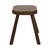 Old wooden stool, milking stool, made of solid wood; this is a rustic and brutalist handmade object from around the...