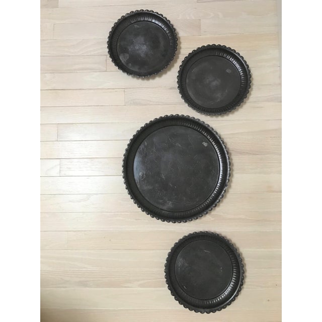 Vintage metal trays/plates of varying sizes with scalloped edge trim, and beautiful oil-rubbed bronze finish. These...