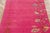 Hand-knotted in wool, this 3x12 contemporary Chinese Deco runner presents an open magenta field detailed with delicate...