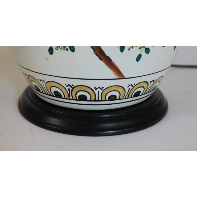 Pair of vintage ginger jar style Chinoiserie porcelain table lamps, featuring hand-painted bird and floral motifs. No...
