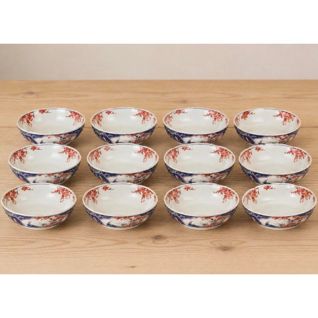 A beautiful set of twelve vintage Japanese Arita Imari porcelain bowls dating to the mid- to late 20th century. Each bowl...