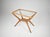 An Italian coffee table in wood and glass, dating from the 1940s–50s and designed in the style of Cesare Lacca. The table...