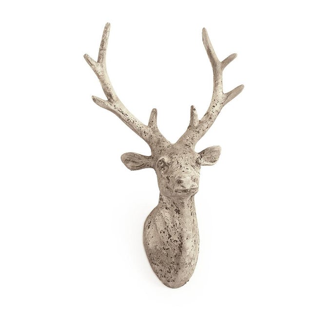 The Deer Head from Zentique is a compact decorative terracotta deer head wall mount. The 17.5" height adds rustic charm....