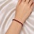 This sterling silver .925 flexible bracelet features numerous natural oval garnets totaling 20 carats. Measuring 7.75...