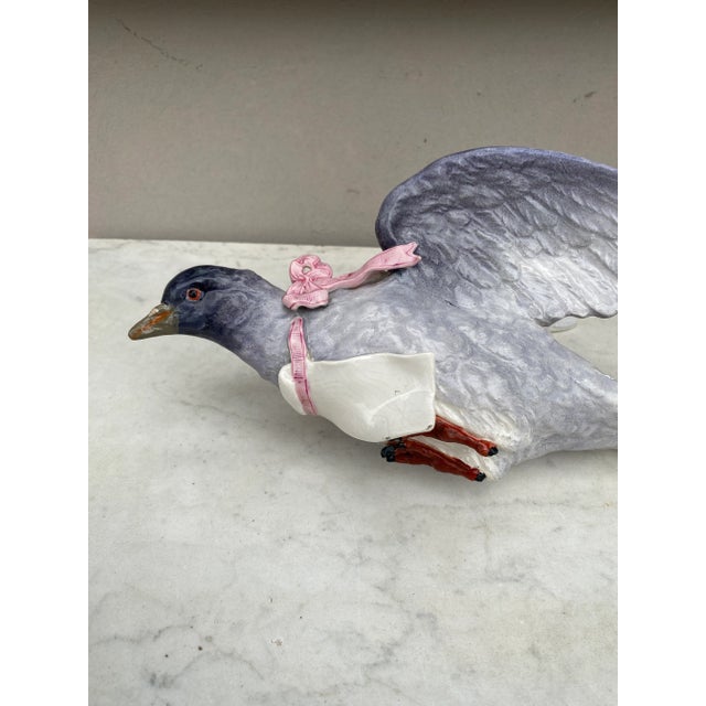 Large 19th Century French Majolica Pigeon Wall Pocket. The pigeon have a pink ribbon and carry a white card.