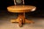 Vintage circular oak dining table. This piece features sturdy, simple construction with minimal ornamentation. The surface...