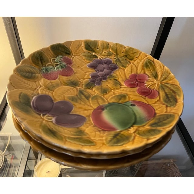 Set of 6 French majolica fruit pattern chargers made by Sarreguemines. They have relief images of fruits including...