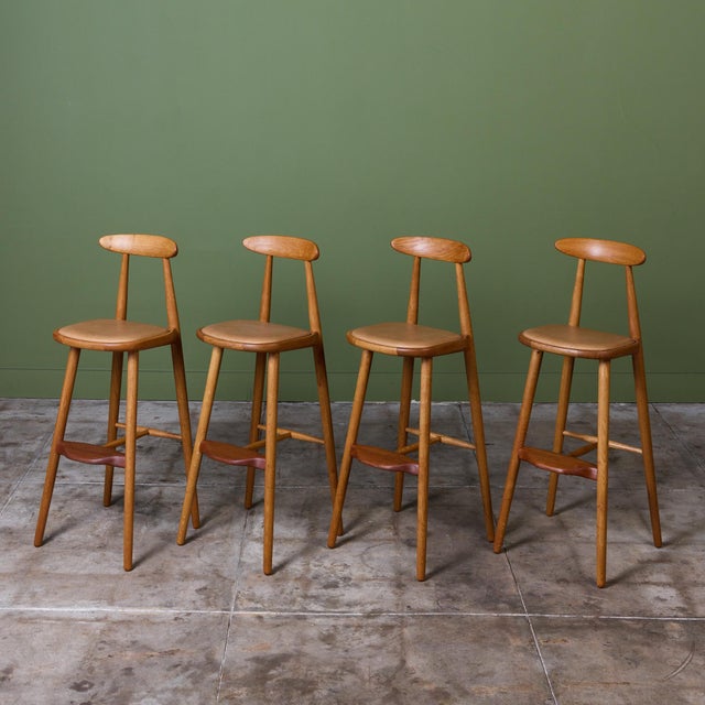 Set of four stools by Vilhelm Wohert for Stolefabriken Odense, c.1950s Denmark. These bar height stools feature a newly...