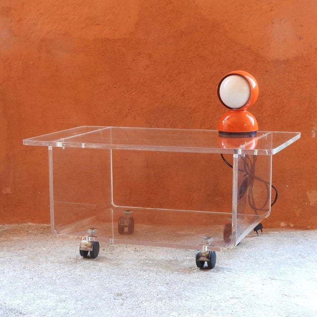 Vintage cart made of clear acrylic glass with gold wheels for easy movement. Ideal as a stand for a stereo or TV, side...