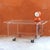 Vintage cart made of clear acrylic glass with gold wheels for easy movement. Ideal as a stand for a stereo or TV, side...