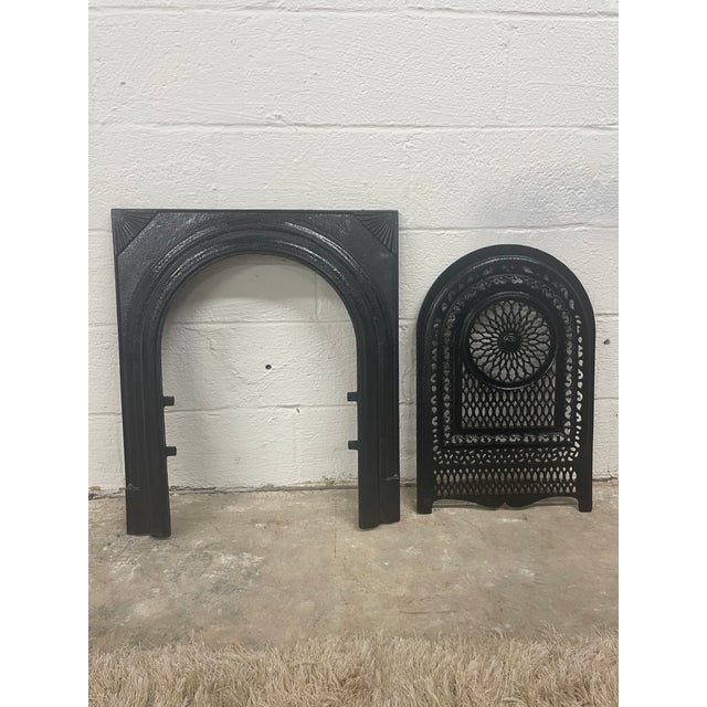 A remarkable piece of Southern architectural history, this late 19th-century cast iron fireplace surround and matching...