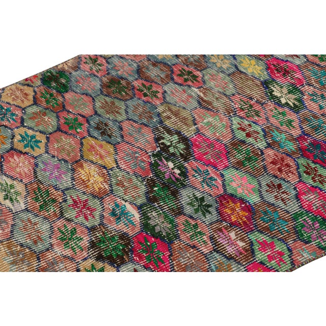 Hand-knotted in wool and originating from Turkey circa 1960 – 1970, this 3x5 vintage Zeki Müren rug is a unique addition...
